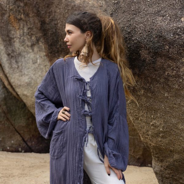 Discover the elegant Aimi Kimono, crafted from lightweight raw cotton for effortless style. Featuring wide sleeves, a round neckline, and versatile front ties, this duster kimono is perfect for any wardrobe. Available in plus sizes, it offers a flattering fit for all body types.