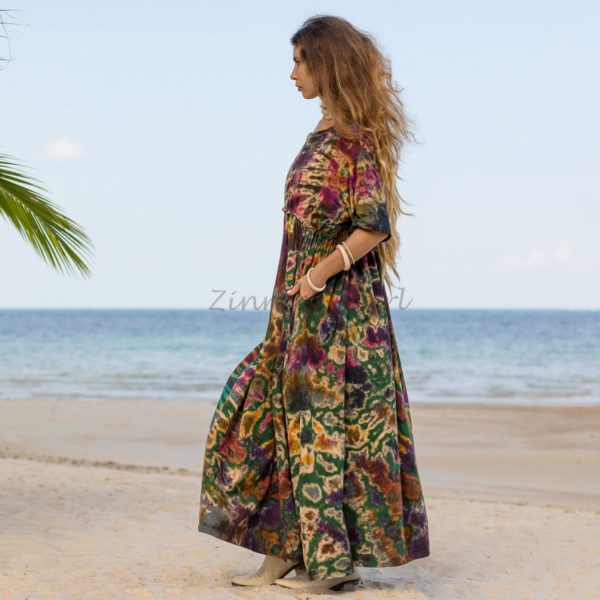 Celebrate your unique style with our Kalina Bliss Tie Dye Maxi Dress! Show off your true self in boho-inspired, plus-size fashion from Zinnia Pearl. Our inclusive and affordable line lets you express yourself authentically with each exquisite piece. * Handmade Kalina Bliss Tie Dye Maxi Dress: Designed with love and crafted with care, this exquisite dress is a must-have for self-expression. * Vibrant and Joyful: Radiate positivity with the dress's exuberant tones and vibrant hues. * Unique Baby Doll Silhouette: Stand out from the crowd with a dress that embodies individuality. * Finest Quality Jersey Fabric: Experience the softness against your skin and admire the eye-catching tie-dye design. * Boho-Chic Elegance: Add a touch of vintage Italian design to your look with the fashionable tint. * Perfect for Any Occasion: Whether it's a festival or a sunny day, this dress is a go-to choice. * Comfortable and Stylish: Featuring a pull-over style, flowing floor-length hem, and drop shoulder sleeves. * Inclusive Sizing: We cater to our beautiful plus-size community with one inclusive sizing option up to 1-2X * 100% Cotton: Experience comfort and breathability in this natural fabric. * Embrace Variations: Each dress is unique due to the tie-dye technique, showcasing the artisanal craftsmanship.